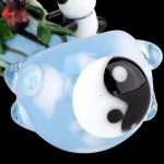 A close-up of the Empire Glassworks Spoon Pipe - Climbing Pandas, showing a sculpted panda clinging to the bowl’s clear glass exterior.