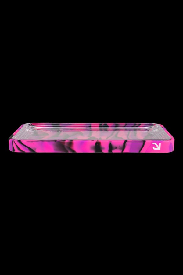 Pink and black patterned cannabis rolling tray against a black background.