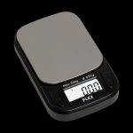 Digital scale displaying 0.77g, commonly used for measuring cannabis.