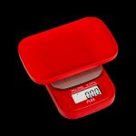 Red digital scale displaying “0.00” grams, commonly used for measuring cannabis.