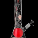 Front view of the Famous Design "GOA" Beaker Bong, a clear glass piece with intricate white linear designs on its bulbous base.