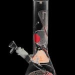 Front view of the Famous Design "GOA" Beaker Bong, a clear glass piece with patterned details against a black background.