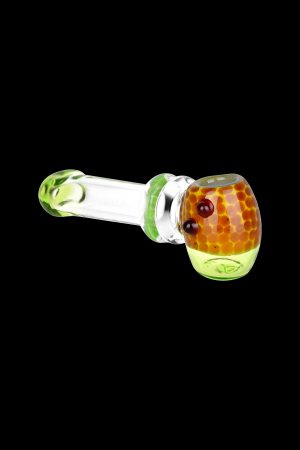 Green and orange glass pipe isolated on a black background.