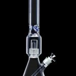 Clear glass bong with intricate percolator filtration system, isolated on a black background.