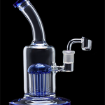 Blue glass water pipe with quartz banger.