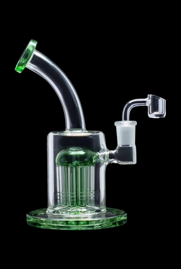 Green glass dab rig with multiple diffusion stacks, isolated on a black background.