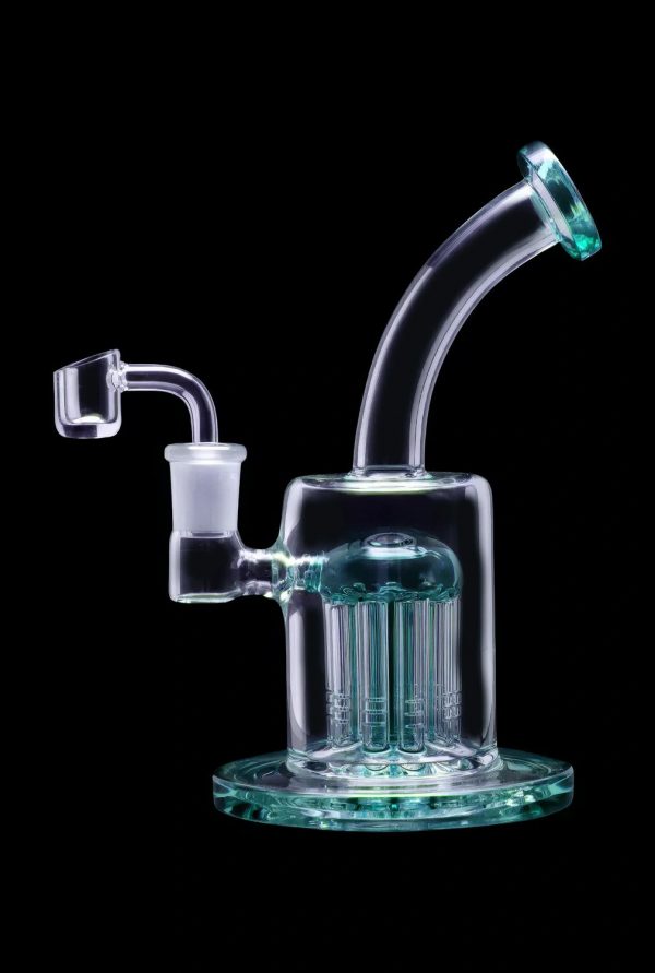 Light blue glass rig with multiple diffusion stems and a quartz banger.