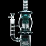 A studio shot of the 13.5-inch Smoke Cartel Straight Tube with Dual Octopus Perc, showcasing its clear glass construction and intricate perc design.
