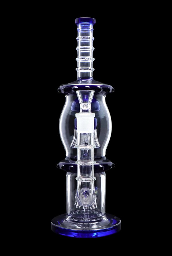 Blue glass water pipe (rig) with intricate percolators, isolated on a black background.