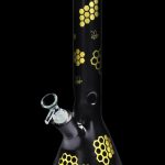 Black glass bong with gold honeycomb and bee designs.