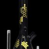 Black glass bong with gold honeycomb pattern, accompanied by a downstem and bowl.