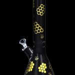 Black glass bong with gold honeycomb and bee designs.