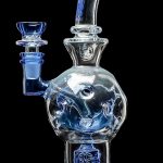 Blue glass water pipe with intricate bubble and floral designs.