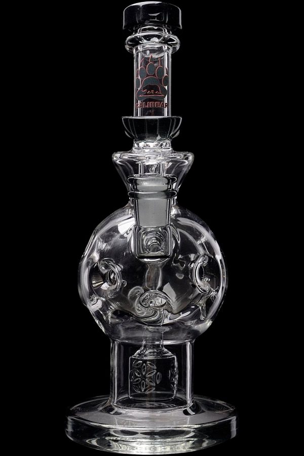 Clear glass water pipe with intricate bubble and swirl design, isolated on a black background.