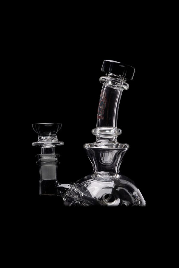 Clear glass water pipe (rig) with intricate design, isolated on a black background.