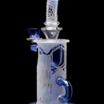 Frosted glass water pipe (bong) with blue accents and intricate geometric designs, isolated on a black background.
