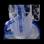 Blue glass water pipe with intricate etched designs.