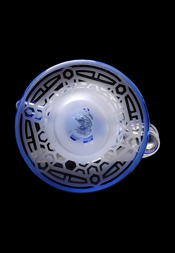 Blue glass bubbler with geometric patterns, viewed from above.