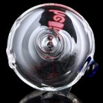 A close-up, angled view of the GRAV® Helix Taster Chillum, showcasing its clear glass construction and streamlined design.