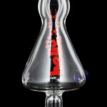 A close-up, angled view of the GRAV® Helix Taster Chillum with clear glass and a minimalist design.