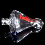 A detailed side view of the GRAV® Helix Taster Chillum, showcasing its compact size and sleek, modern design against a dark backdrop.