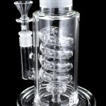 Front view of the GRAV® STAX Flare Base with Coil Showerhead Perc, showcasing its clear glass construction and unique coil perc design.
