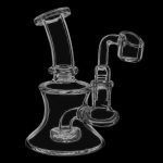 A studio shot of the Simple Scientific Mini Glass Oil Dab Rig with Banger, angled to showcase its compact size and clear glass construction.