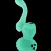 Front view of the Glow in the Dark Glass Bubbler, emitting a bright green glow against a black background.