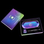 Front view of the Green Monkey Rainbow Finish Rolling Tray & Grinder Kit, showcasing its vibrant, colorful finish on a black surface.