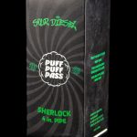 A green box for a “Sour Diesel” branded 4-inch Sherlock pipe, featuring leaf graphics and text indicating it's for legal herb use only.