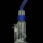 Clear glass bubbler with blue accents and a cannabis smoking bowl.