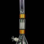 A glass bong with multiple percolation chambers and a removable glass bowl.