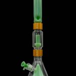 Green glass dab rig with water filtration system.