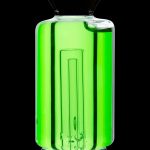 Green glass bubbler with vertical ridges, illuminated from within.