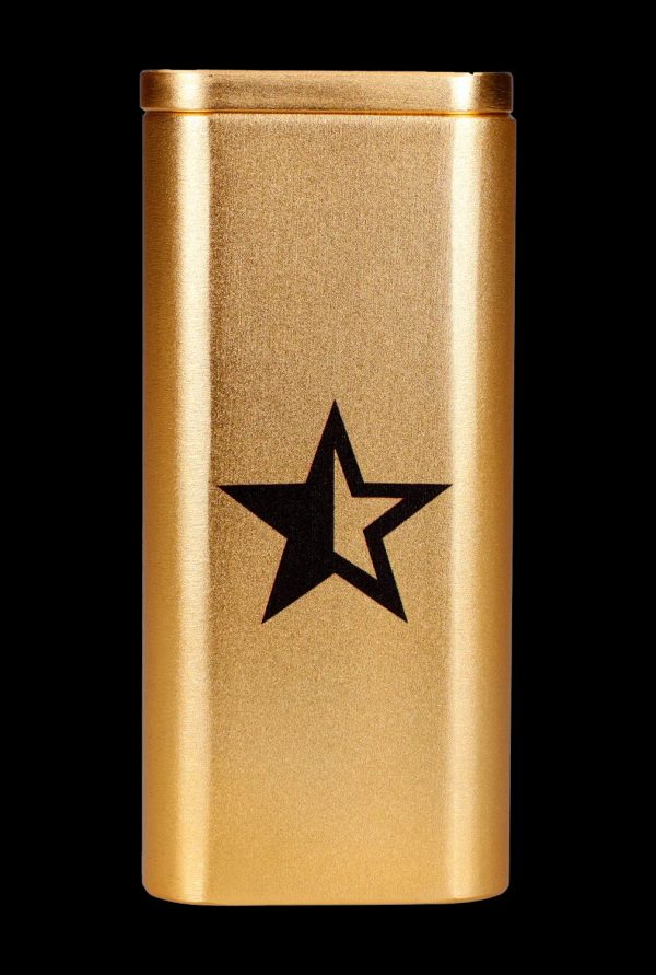 Gold cannabis storage tube with a black star emblem.