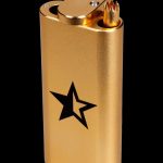 Gold lighter with a black star emblem, often used for cannabis consumption.