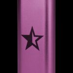 Purple metal cannabis storage tube with a black star emblem.