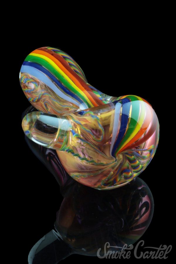 A vibrant, angled view of the Heavy Cane Worked Rainbow Spoon – Rainbow Mega Pipe, showcasing its colorful, sculpted glass design.