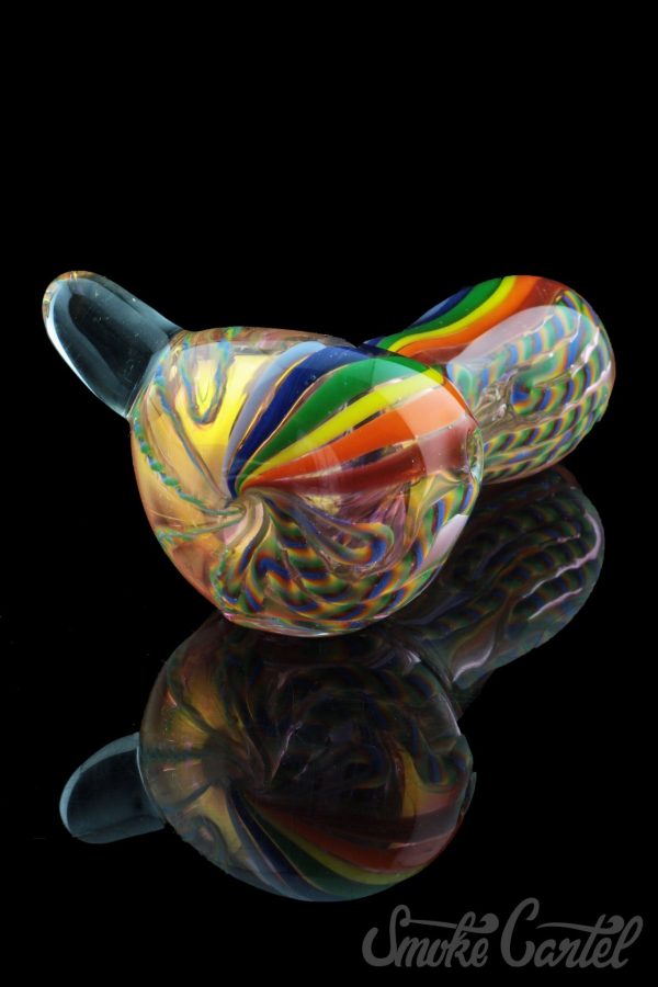 A side view of the Heavy Cane Worked Rainbow Spoon - Rainbow Mega Pipe, showcasing vibrant, colorful glasswork.