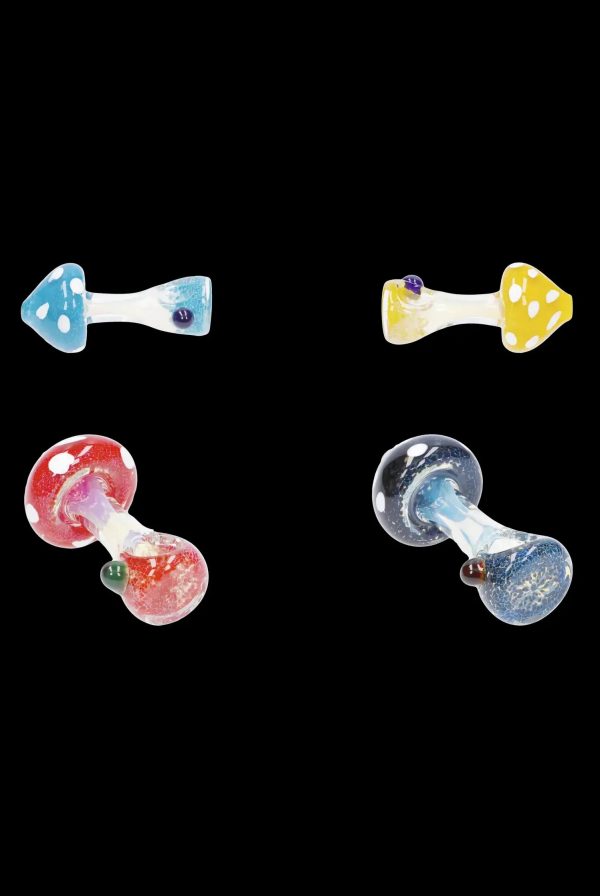 Four colorful glass mushroom-shaped smoking pipes on a black background.