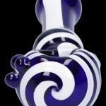 Blue and white glass cannabis oil rig with swirling pattern.