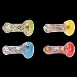 Four colorful glass smoking pipes against a black background.