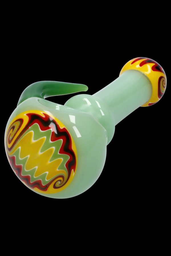 Green glass bubbler with red and yellow flame design.