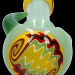 Green glass bubbler with colorful, swirling internal design.