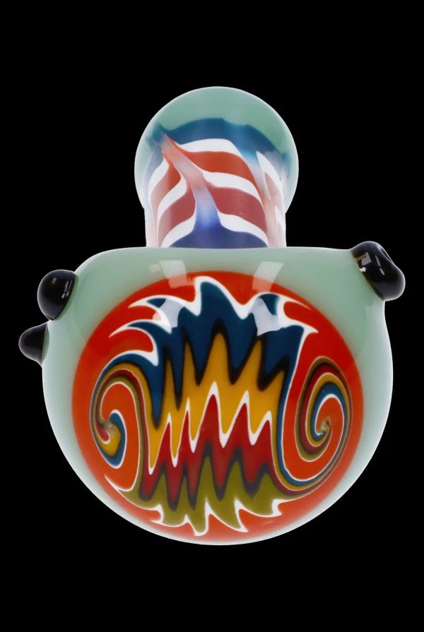 Hand-blown glass cannabis water pipe with vibrant red, white, and blue swirl design.