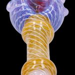 Glass pipe with swirling purple and amber patterns.