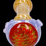 Hand-blown glass pipe with swirling red, orange, and yellow patterns.