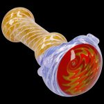 Hand-blown glass pipe with red and gold swirl patterns against a blue and amber backdrop.