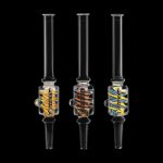 Three glass oil rigs with colorful accents against a black background.