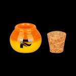 Orange glass dab rig with a cork stopper.